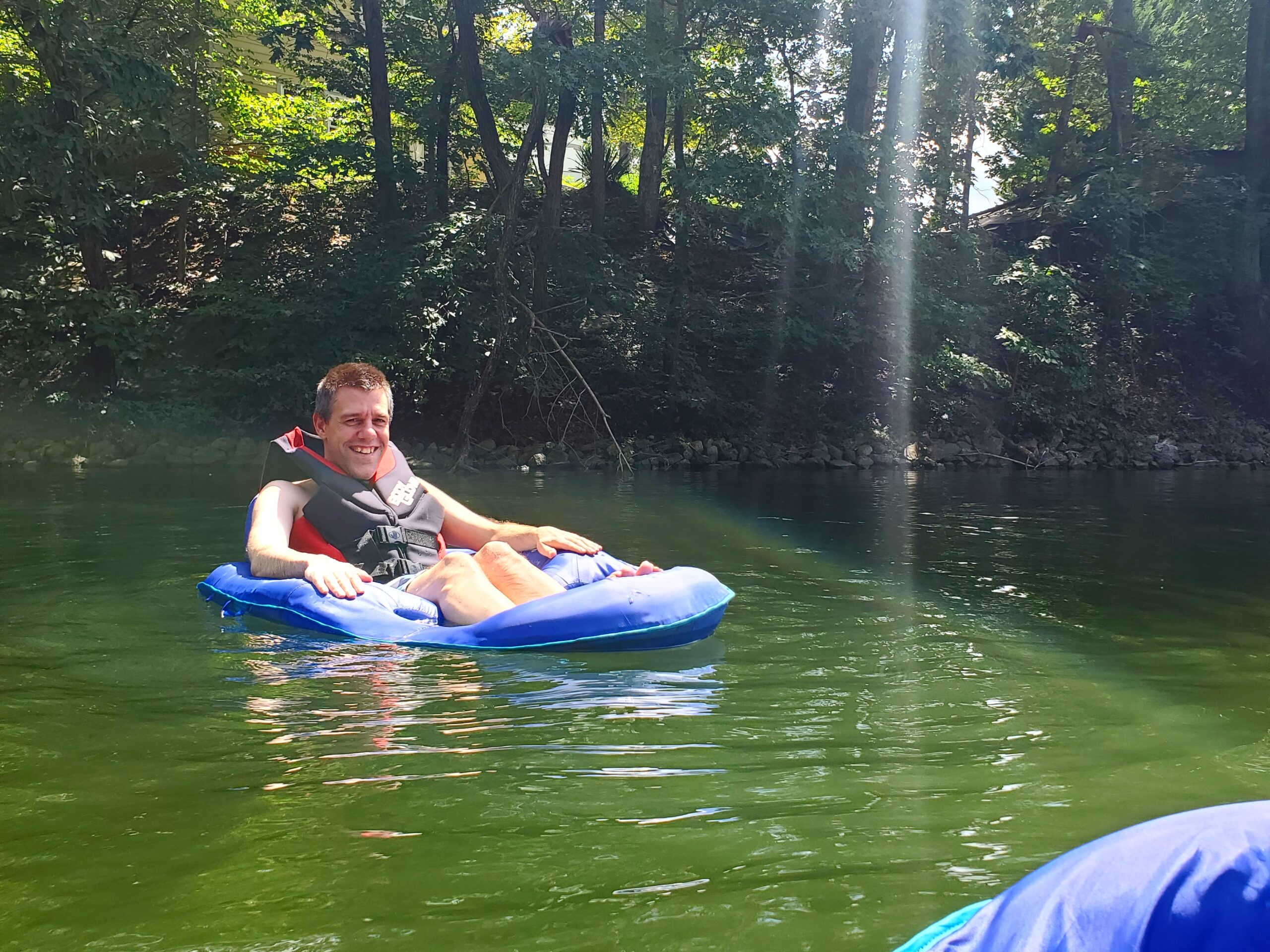 Gabriel Homes resident on a raft on the lake.