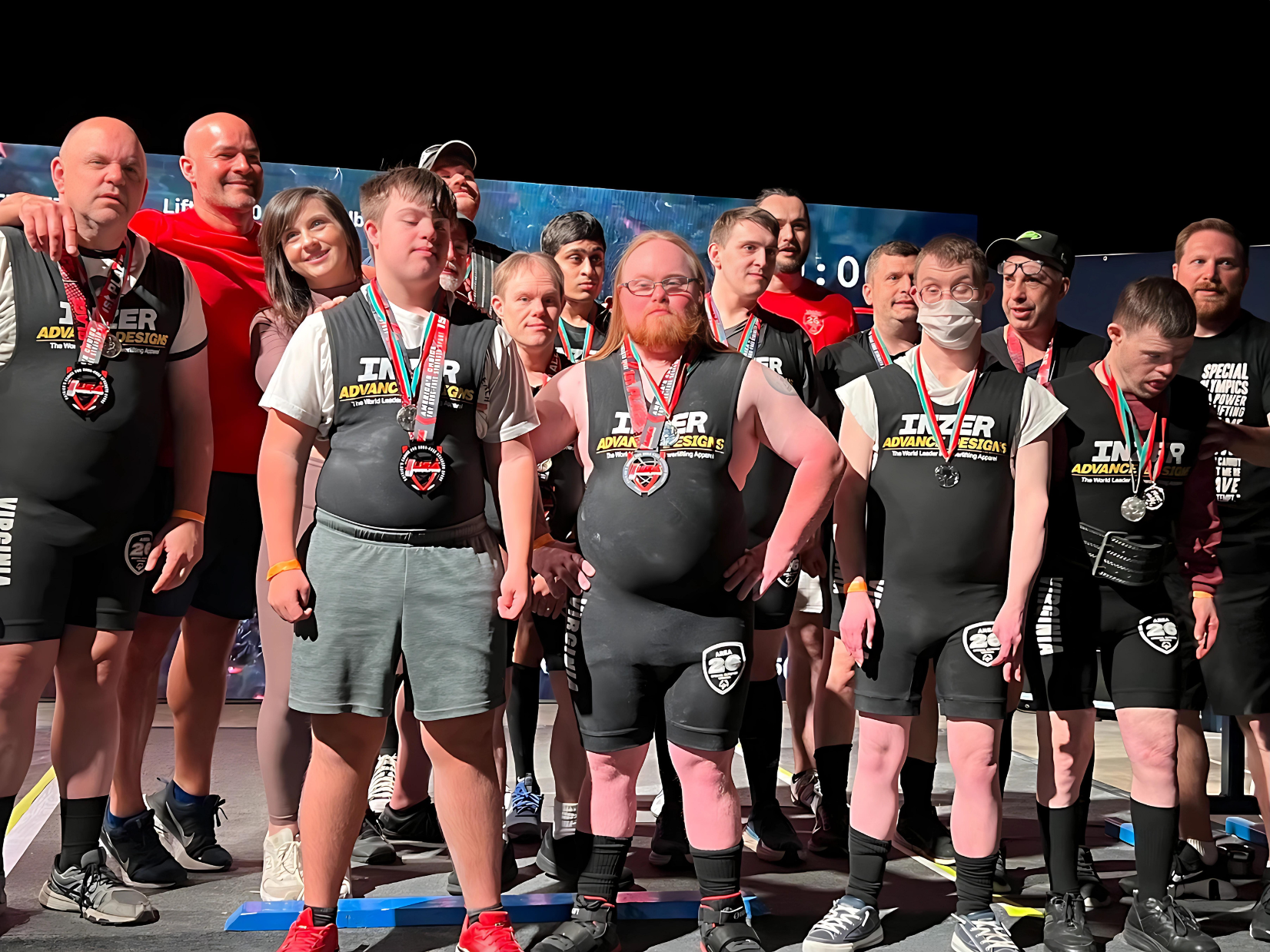 Gabriel Homes residents at powerlifting tournament with their team.