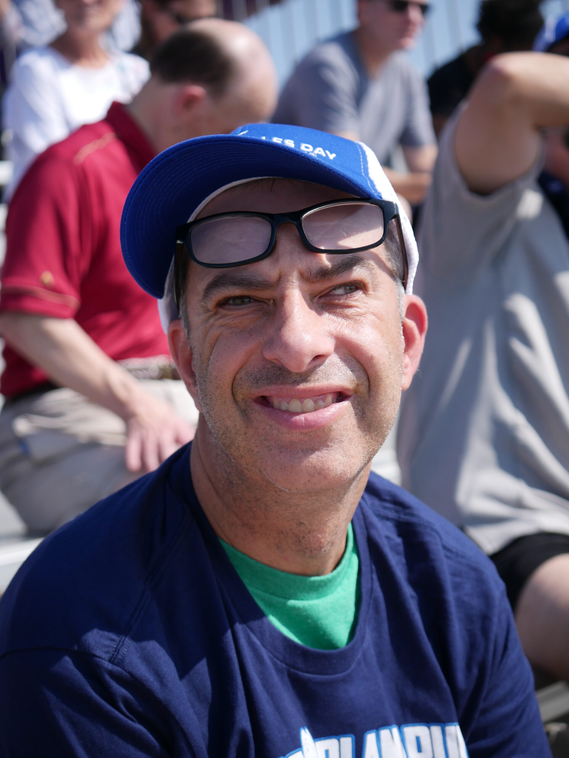 Gabriel Homes resident sitting in bleachers.