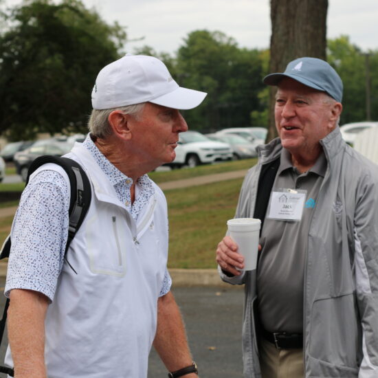 Gabriel Homes Board Member Jack Mannion (right) with golf tournament attendee.