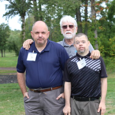 Gabriel Homes Board Member Gary Le Francois (center) with residents (left and right).