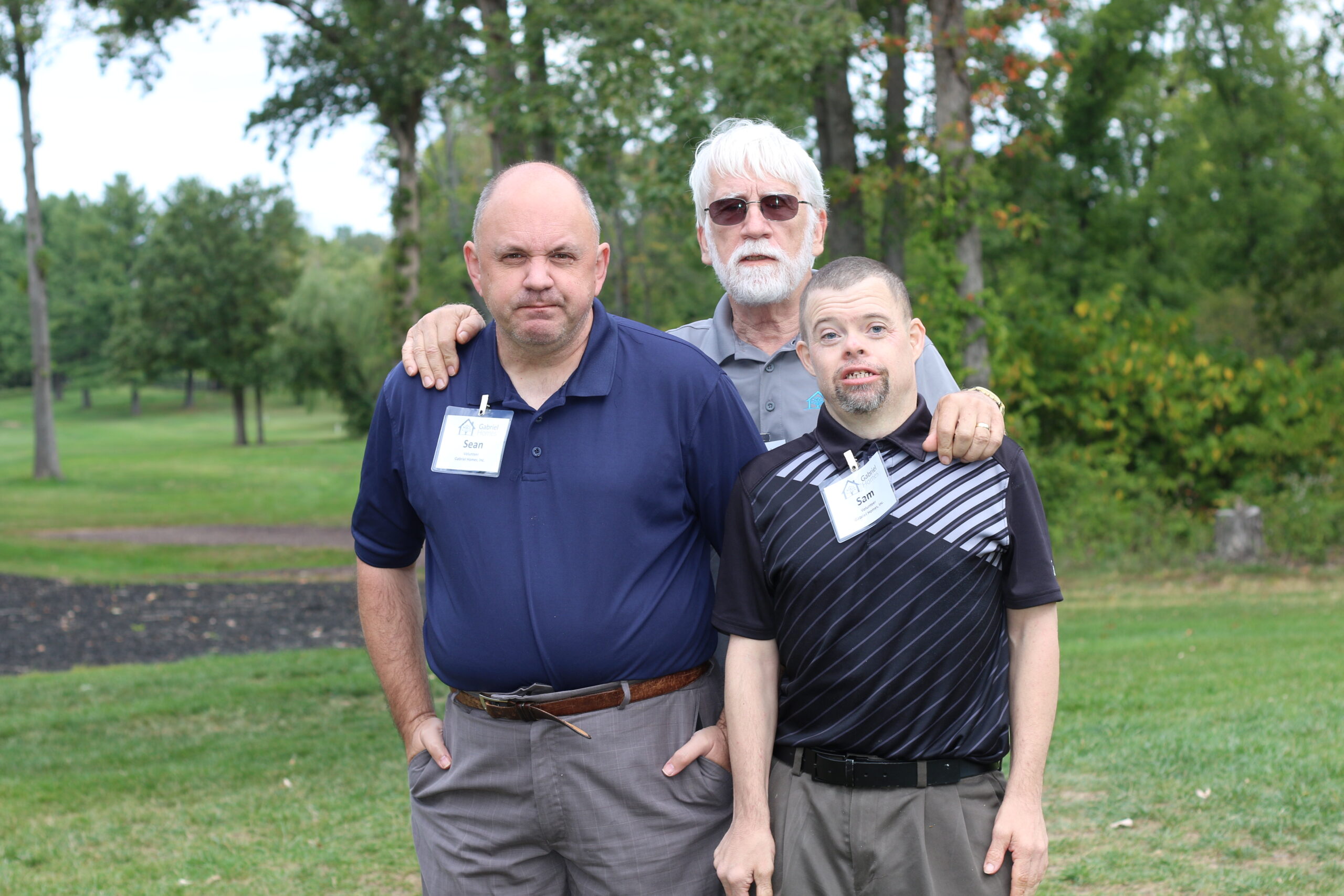 Gabriel Homes Board Member Gary Le Francois (center) with residents (left and right).