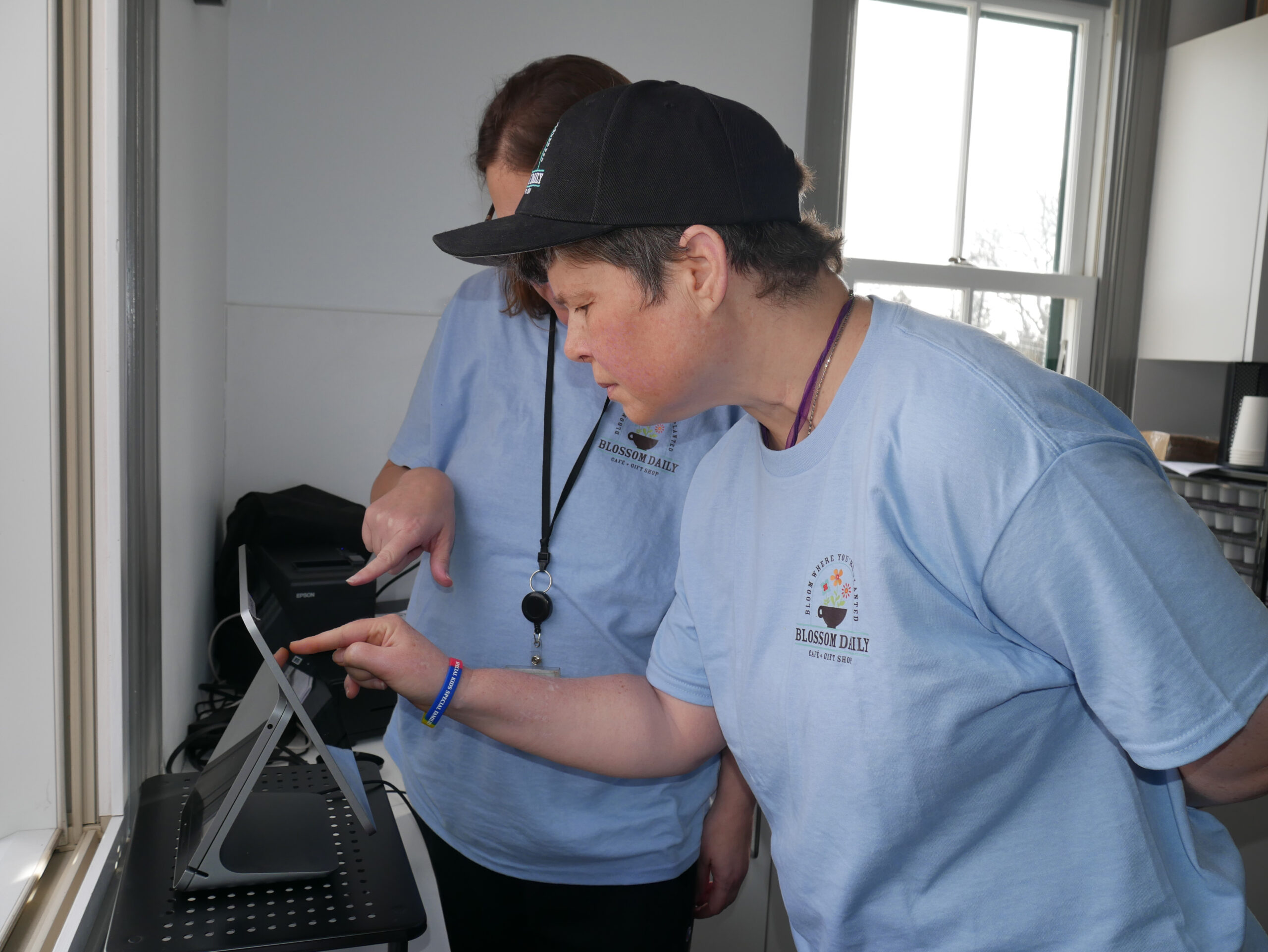 Gabriel Homes resident preparing coffee for customer.