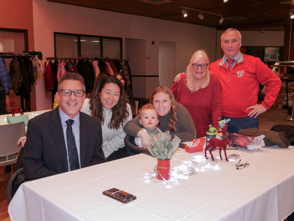 Gabriel Homes resident (left) with family at the 2024 Christmas party.
