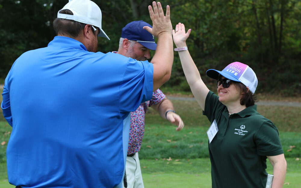 High-fiving at the 30th Annual Gabriel Homes Golf Tournament.