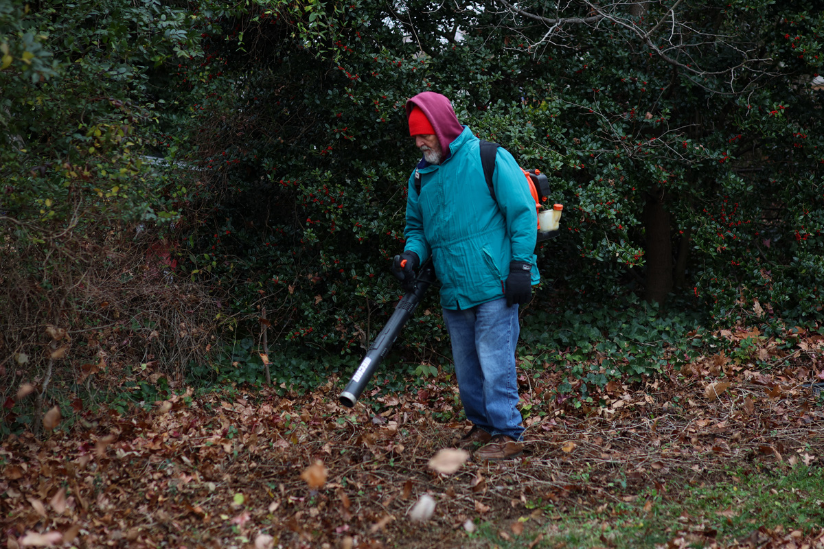 Mickey Femino, Gabriel Homes Work Crew member, using a leaf blower.