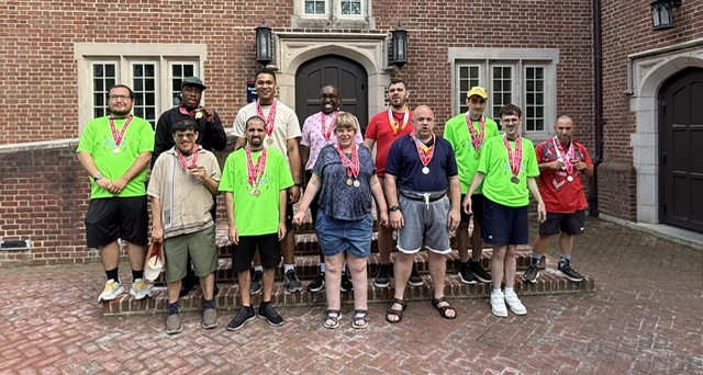 Special Olympics track and field team, featuring a Gabriel Homes resident (front).