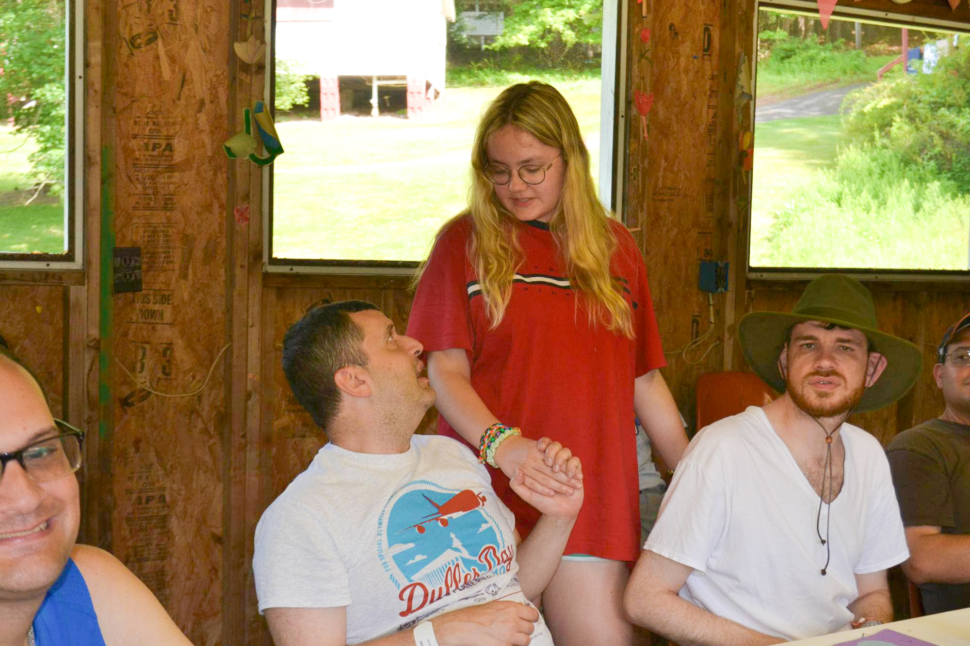 Gabriel Homes resident (left) talking to Camp Jaycee staff (center).