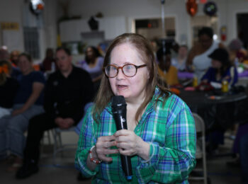 Gabriel Homes resident performing karaoke at the Boo Bash.