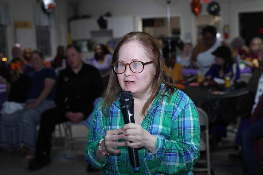 Gabriel Homes resident performing karaoke at the Boo Bash.
