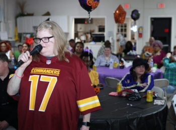 Gabriel Homes resident performing karaoke.