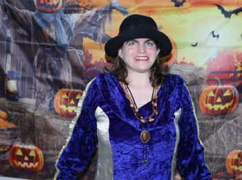 Gabriel Homes resident in front of a Halloween backdrop.