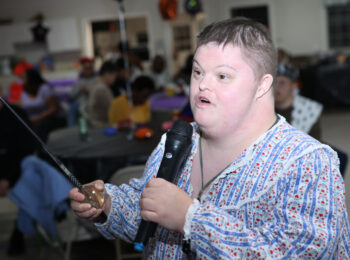 Gabriel Homes resident performing karaoke.