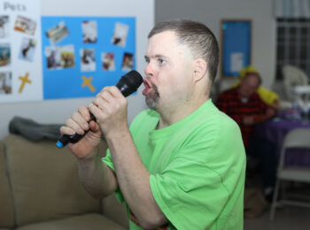 Gabriel Homes resident performing karaoke.