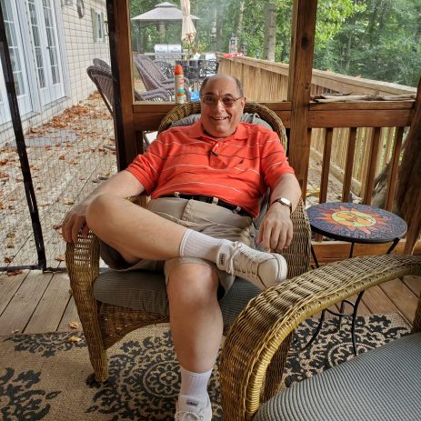 Gabriel Homes resident sitting on a porch.