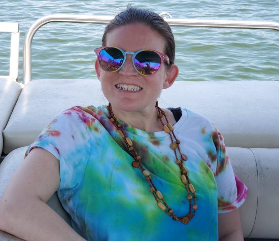 Gabriel Homes resident on a boat at a lake. Gabriel Homes resident on a boat at a lake.