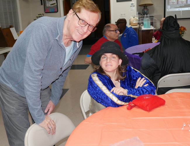 Tom Stringer (left), Hall of Fame class of 2025, with Gabriel Homes resident (right) at the Boo Bash.