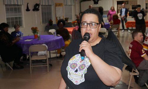 Gabriel Homes resident singing karaoke at the Spring Fling.