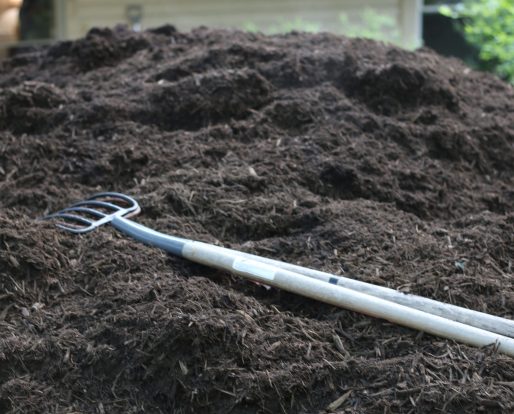 Rake used by Gabriel Homes Work Crew in mulch.