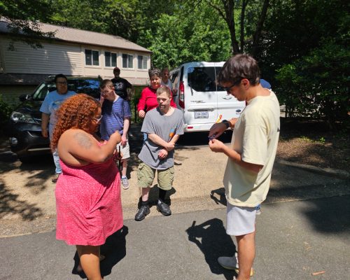 Gabriel Homes staff handing sparklers to residents on Independence Day, July 4, 2025.
