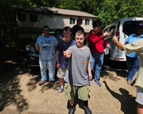Residents holding sparklers at Gabriel Homes.