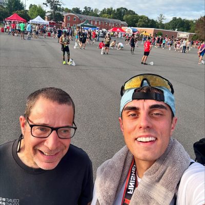 Gabriel Homes resident (left) standing with Daniel Borges, progradm coordinator at Gabriel Homes, at the Marine Corps 12K in Quantico.
