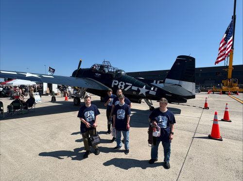 Gabriel Homes residents in front of a plane at 2025 Dulles Day.