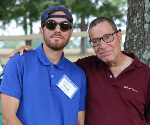 Daniel Borges (left), program coordinator at Gabriel Homes, with Gabriel Homes resident (right) at the 30th Annual Golf Tournament.