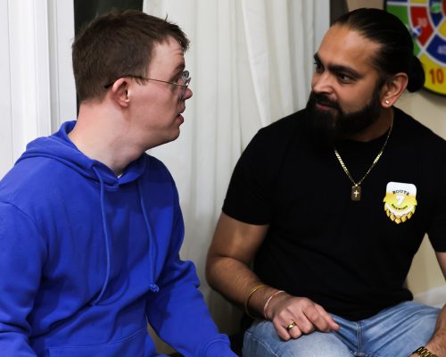 Route 7 Brewing owner (right) conversing with Gabriel Homes resident (left).