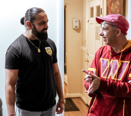 Route 7 Brewing owner (left) conversing with Gabriel Homes resident (right).