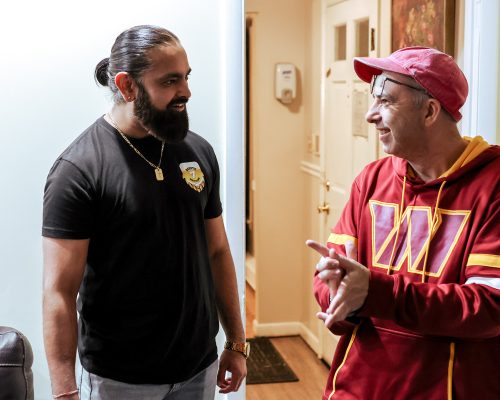 Route 7 Brewing owner (left) conversing with Gabriel Homes resident (right).