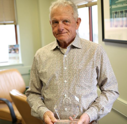 Jim Anderson and his plaque for his induction into the Gabriel Homes Hall of Fame.