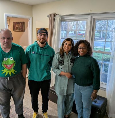 Gabriel Homes resident (left) and staff at a St. Patrick's Day party.