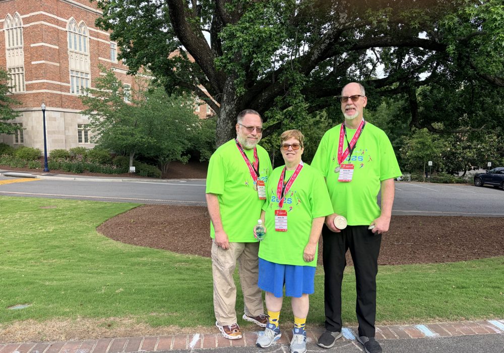 Gabriel Homes resident (right) wearing their Special Olympics bowling medal after competing in the Virginia state games.