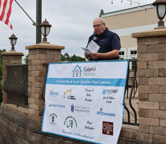 Monsignor Bob Cilinski delivering remarks at the Gabriel Homes Golf Tournament.