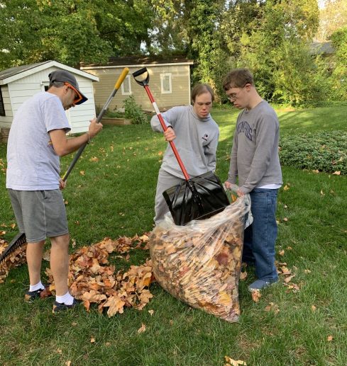 Gabriel Homes residents doing yard work.
