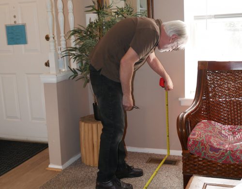 Board Member Gary doing measurements at Gabriel Homes.