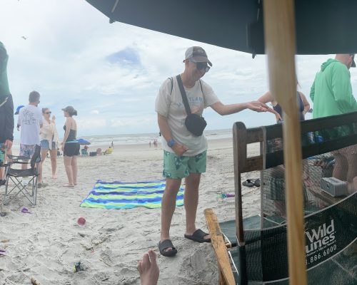 Gabriel Homes resident playing bocce on the beach.