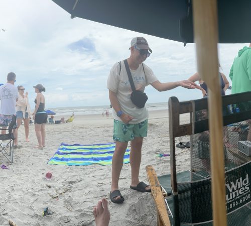 Gabriel Homes resident playing bocce on the beach.