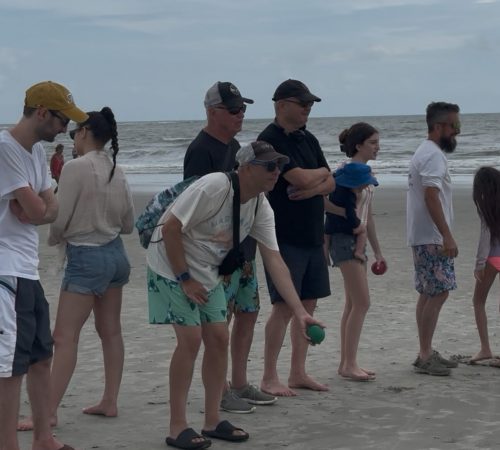 Gabriel Homes resident playing bocce on the beach.