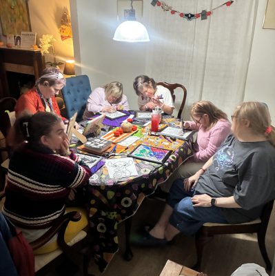 Gabriel Homes residents working on art projects.
