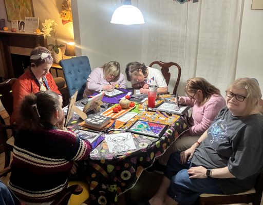 Gabriel Homes residents working on stained glass art projects.