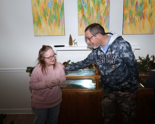 Gabriel Homes residents setting up Christmas lights.