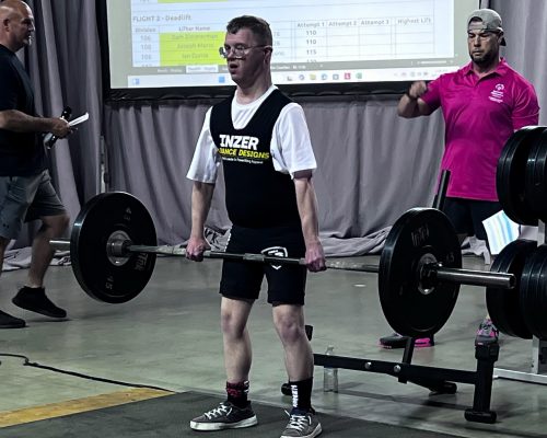 Gabriel Homes resident powerlifting at the Special Olympics.