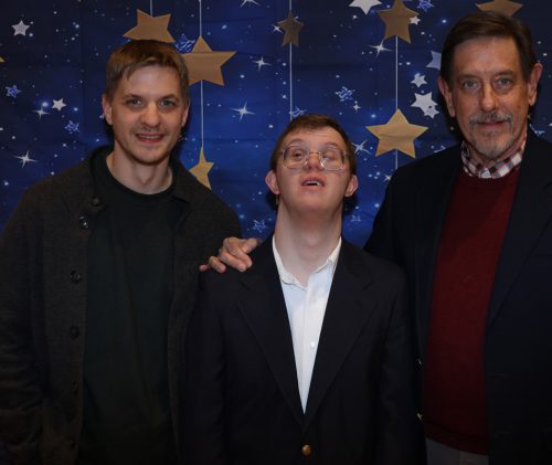 Gabriel Homes resident (center) with family at the Christmas Party.