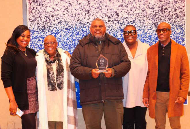 Reuben Sidifall (center), Pierrein Kamdarie (second from right), and family.