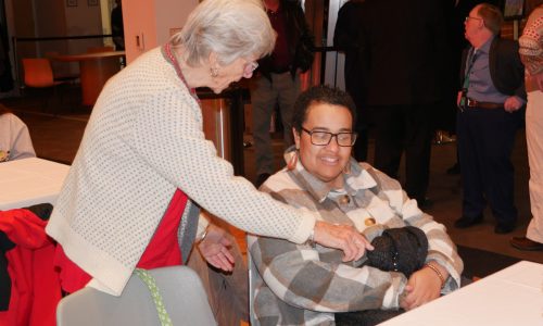 Gabriel Homes resident (right) at holiday party.