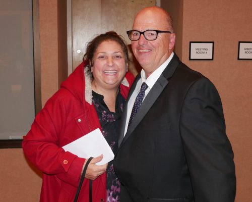 Gabriel Homes Board of Directors Chair Michele Bolos (left) with a resident (right).