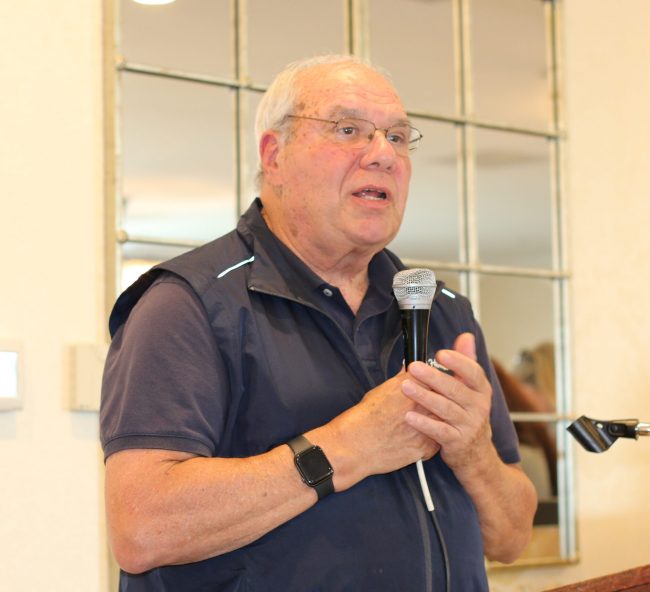 Monsignor Bob Cilinski delivering remarks at Gabriel Homes golf tournament.