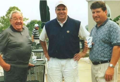 Monsignor Bob Cilinski (center) with participants at the Gabriel Homes Golf Tournament.
